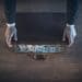 businessman closing briefcase full of cash