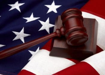 wooden gavel on american flag