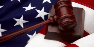 wooden gavel on american flag