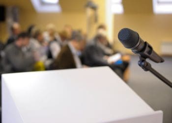 microphone on white lectern at conference