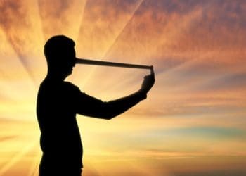 man in silhouette with long nose; concept of lies, deceit