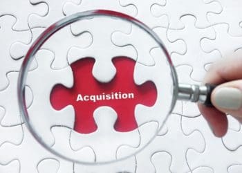 magnifying glass centered on acquisition piece of puzzle