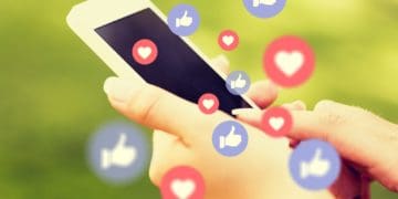 woman holding smartphone with many "like" and "heart" reactions