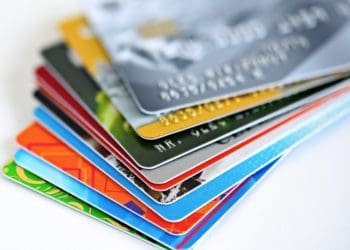 multicolor stack of credit cards on white background