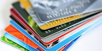 multicolor stack of credit cards on white background
