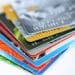 multicolor stack of credit cards on white background