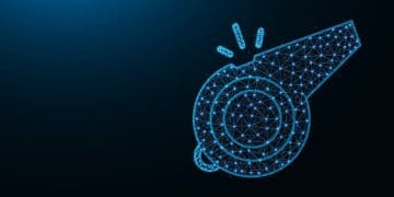 blue polygonal whistle on dark background