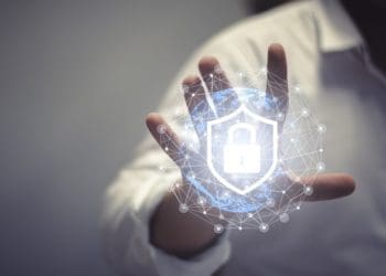 businessman touching virtual data shield