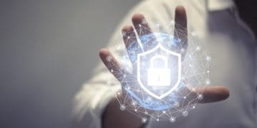 businessman touching virtual data shield