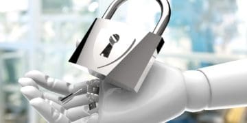 robot hand holding metal padlock and key