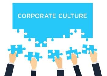 blue corporate culture puzzle being assembled by multiple hands