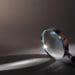 closeup of magnifying glass on gray background