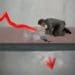 red arrow breaking through floor as businessman looks on