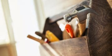 hand tools in wooden toolbox