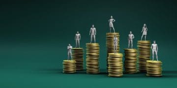 concept of compensation: stacks of coins with people on top