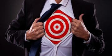 man pulling back button down shirt to reveal target underneath
