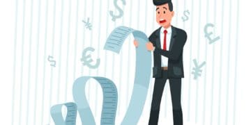 surprised businessman looking at large bill