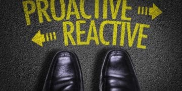 men's shoes standing at crossroads between proactive and reactive