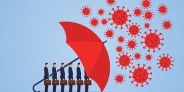 red umbrella protecting businessmen from COVID-19 virus