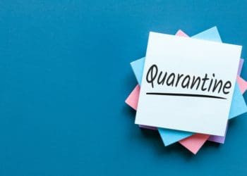 "quarantine" written on stack of post-its