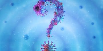 red question mark made of coronavirus on blue background