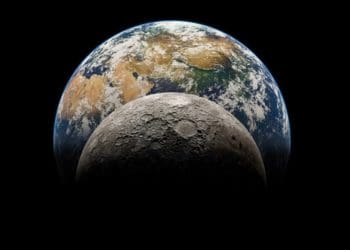 closeup of the moon with Earth in the background