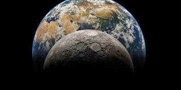 closeup of the moon with Earth in the background