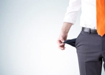 man holding empty pockets out