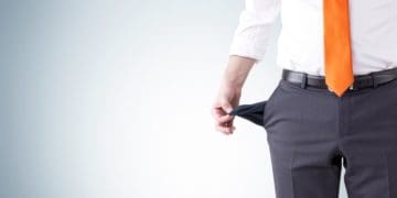 man holding empty pockets out