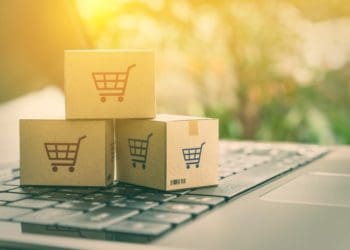 e-commerce, mini cardboard boxes on computer keyboard