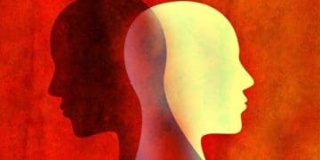 silhouette of contrasting faces in opposite directions