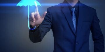 businessman selecting virtual umbrella