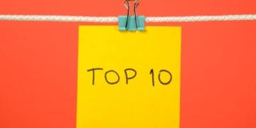 yellow top 10 post-it note on orange background