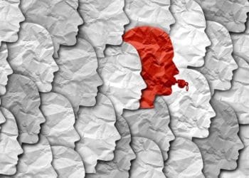 red whistleblower in see of white and gray faces