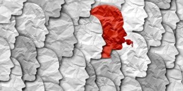 red whistleblower in see of white and gray faces