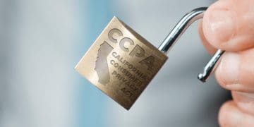 hand holding small CCPA padlock