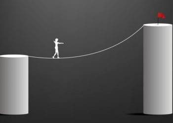 illustration of figure walking highwire between two pillars