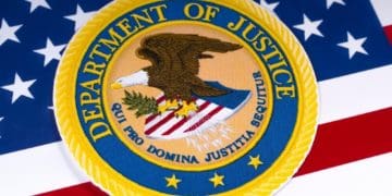 closeup of DOJ emblem on American flag