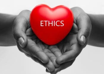 black and white image of hands holding red heart reading "ethics"