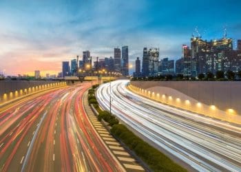long exposure of traffic in Singapore against skyline during sunset