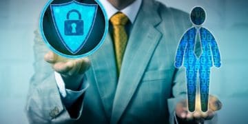 executive holding data security and figure with binary background