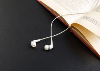 earbuds on an open book