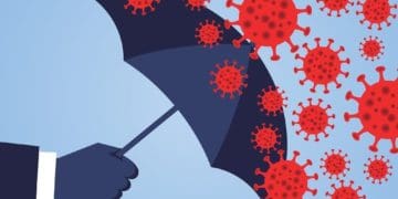 hand holding an umbrella against the 2019 novel coronavirus pneumonia, global plague virus
