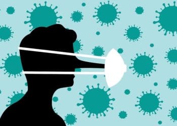 face in silhouette with long nose and stretched medical mask