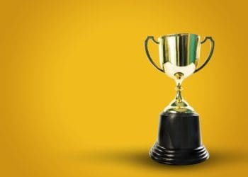 gold award on orange background