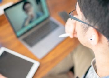 man in online meeting with one person