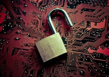 open padlock on red circuit board background