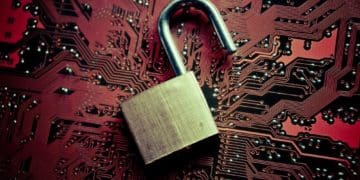 open padlock on red circuit board background