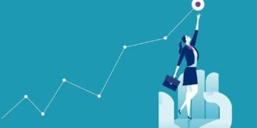 giant hand lifting businesswoman up