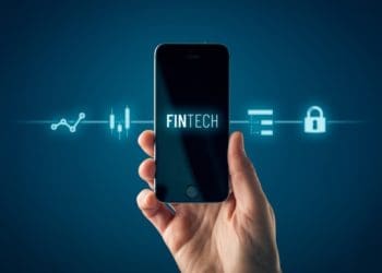 fintech app on smartphone against dark blue background